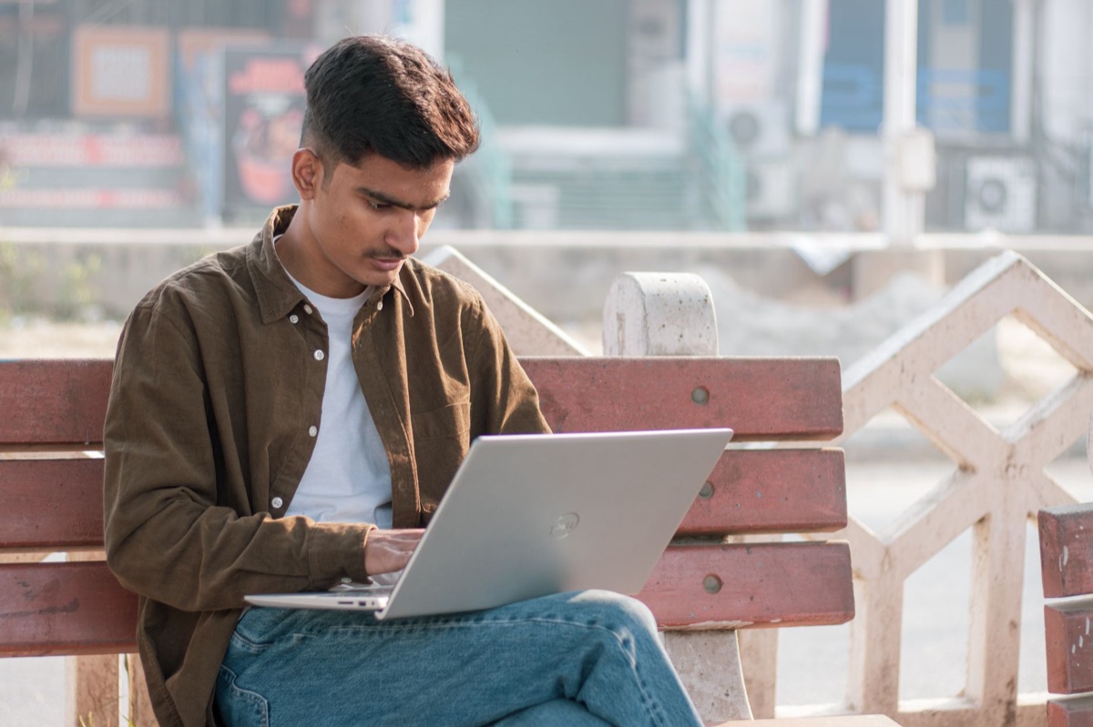 Indian YouTuber with laptop